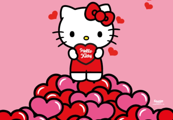 Przebrana Hello Kitty w różowej sukience stoi na różowym tle i promuje wydarzenie w sklepie z logo KiK.