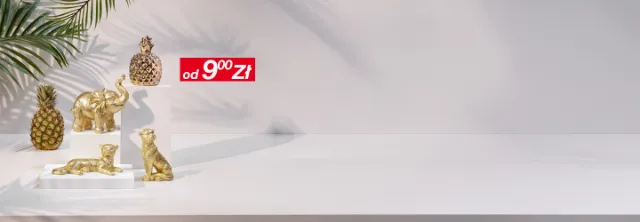 Złote dekoracyjne figurki zwierząt i ananasy na białej powierzchni, z widoczną metką z ceną 1,99 € na pierwszym planie.