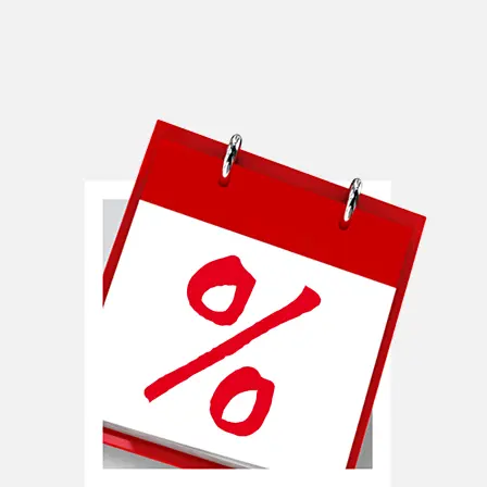 Zbliżenie kalendarza z wyrazistym czerwonym symbolem procentów na przedniej stronie.